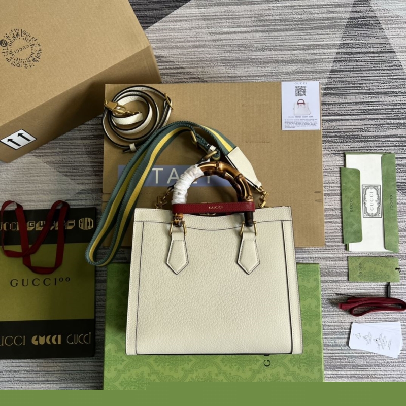 G*u*i top handle bags